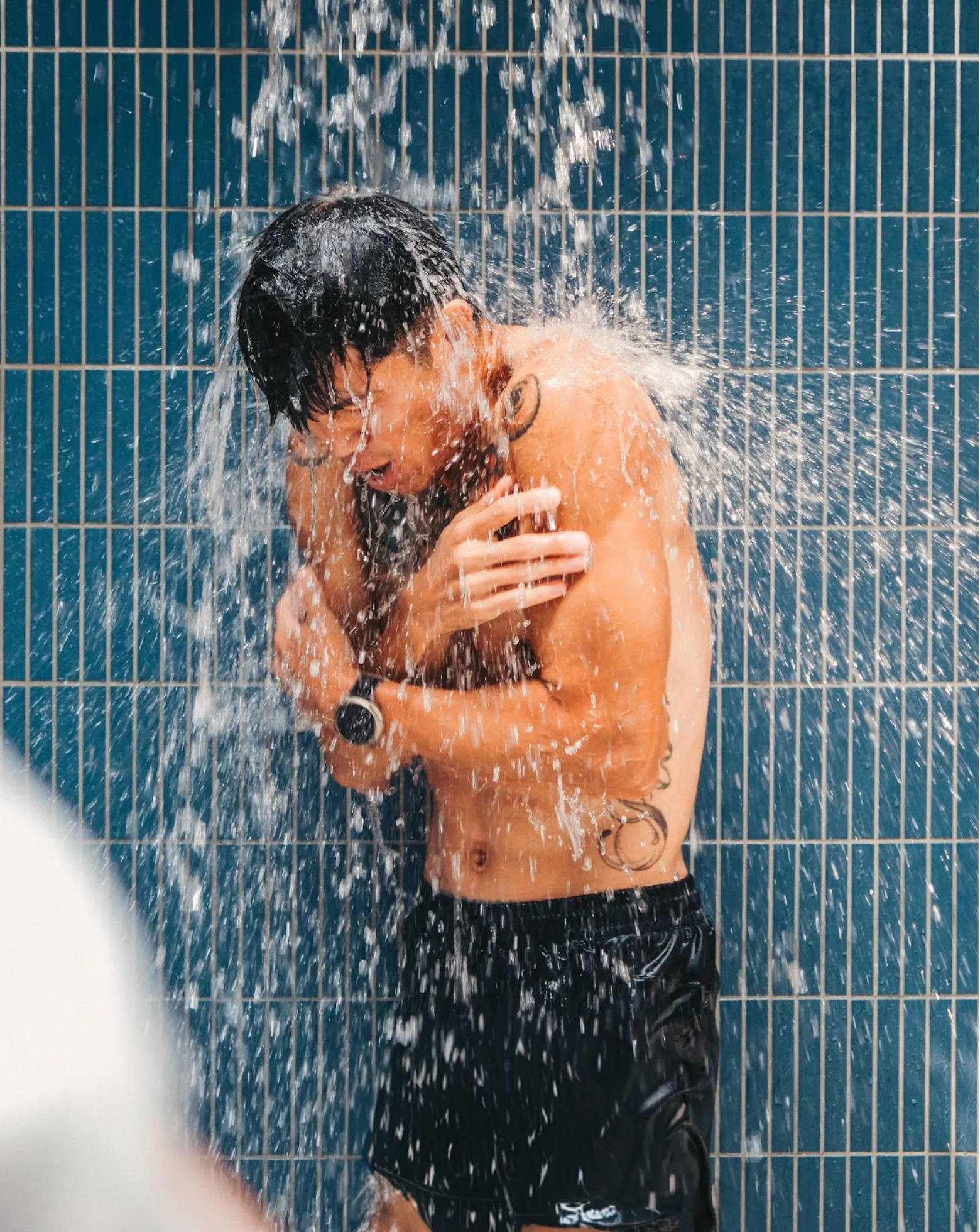 A member bracing under the cold shower